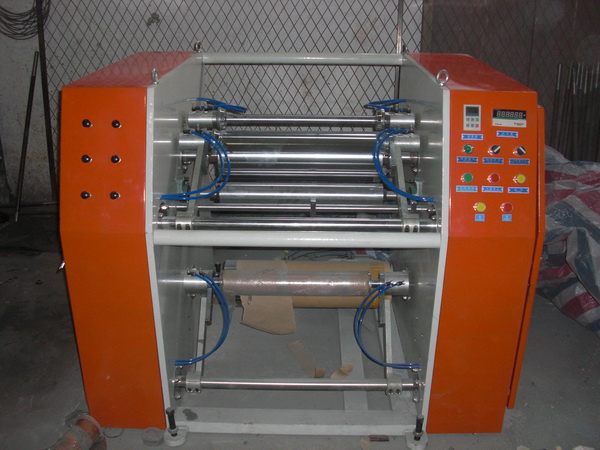 Stretch film rewinding and slitting machine